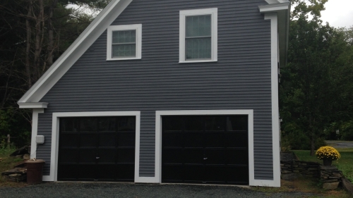 Front of barn converted to two car garage and one bedroom apartment