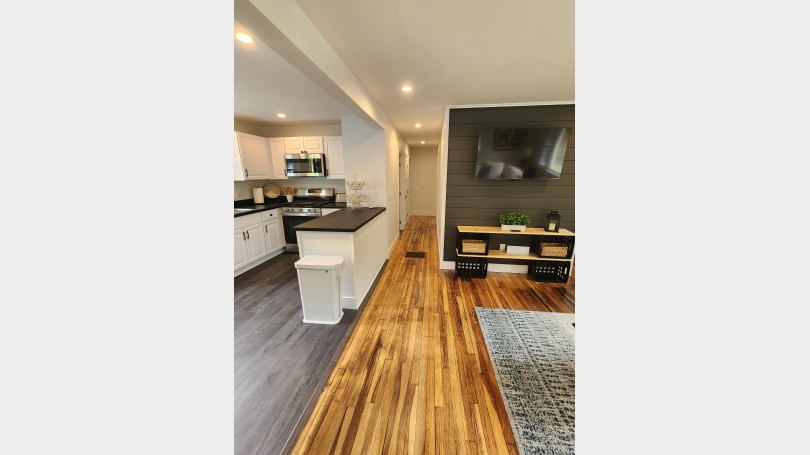 living room, kitchen island, hallway