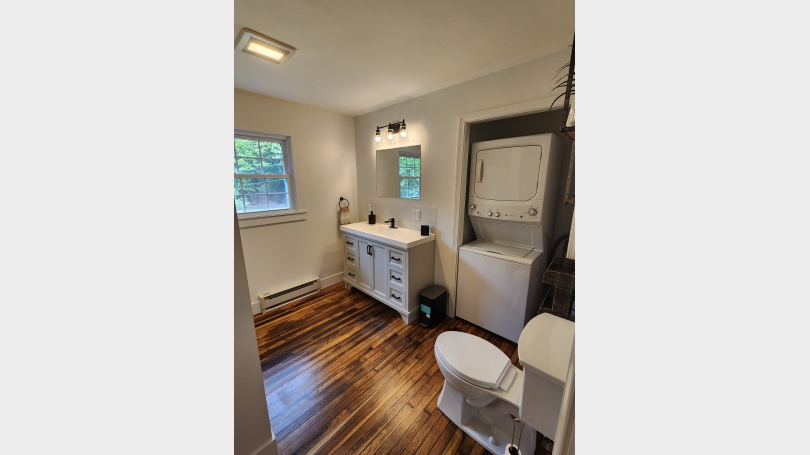bathroom includes washer and dryer 