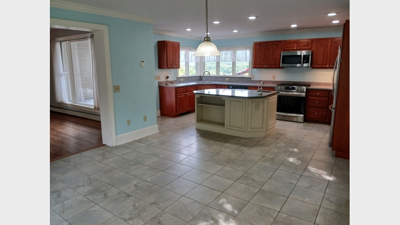 Kitchen Visual of kitchen looking from front to back and into the backyard