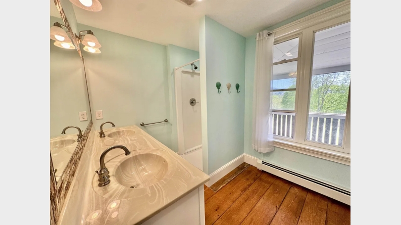 Primary bedroom bathroom looking from bedroom door