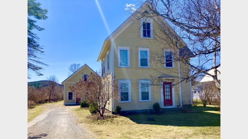 Mellow yellow farmhouse in spring