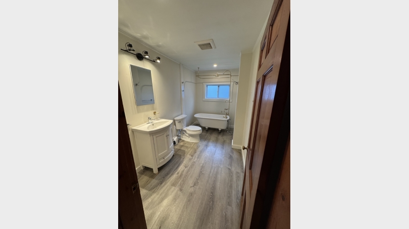 Full bathroom with claw foot tub