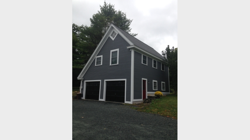 Front and side of building. You can enter through garage or door to interior stairs to apartment.