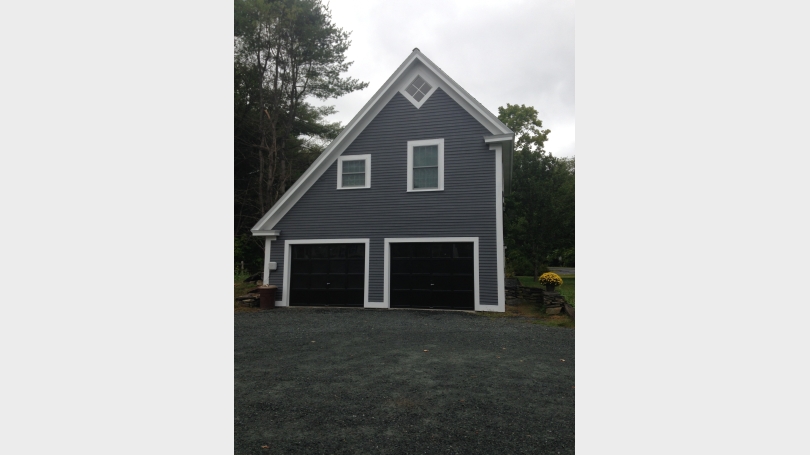 Front of barn converted to two car garage and one bedroom apartment
