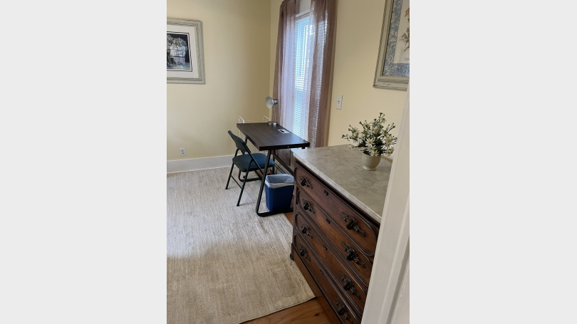 view of bureau and desk