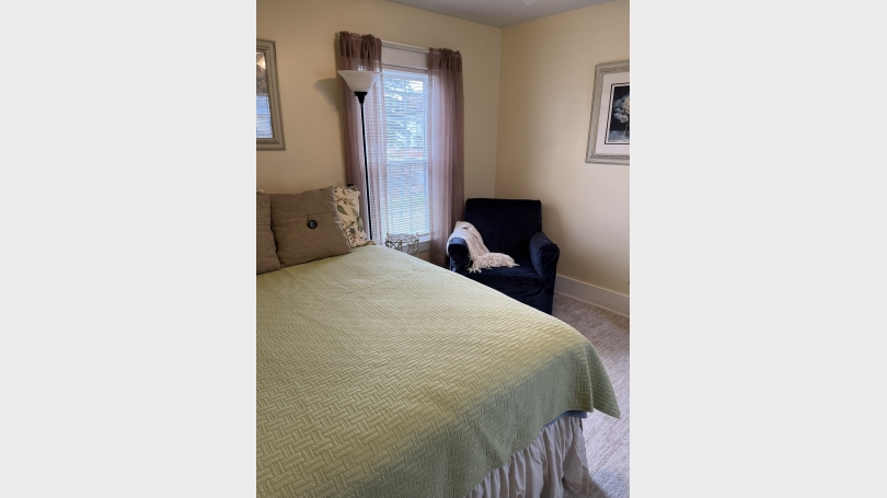 view of chair and bed