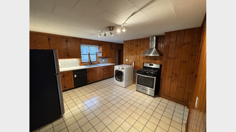 Kitchen with gas stove and dishwasher