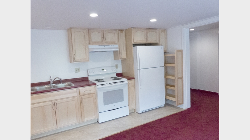 Kitchen with pull out tall cabinet