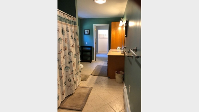 shared bathroom with tub shower